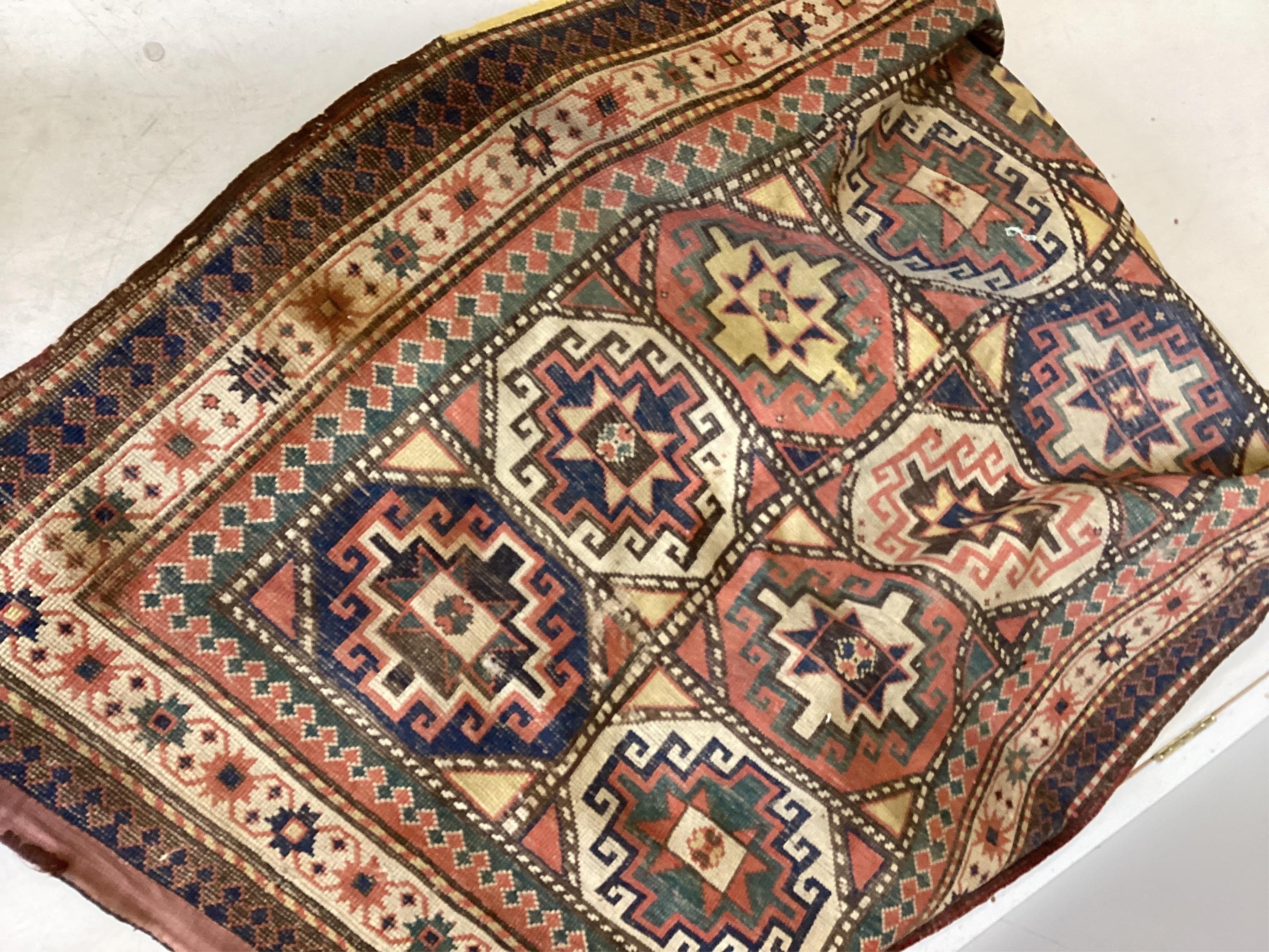 An antique Caucasian Shirvan rug, 184 x 117cm. Condition - poor-fair